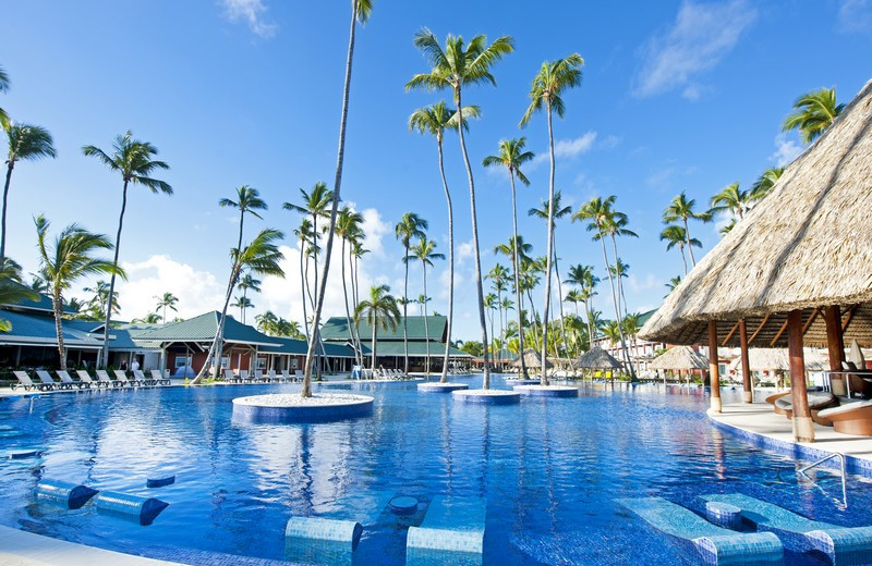 Resort pool with palm trees in Punta Cana